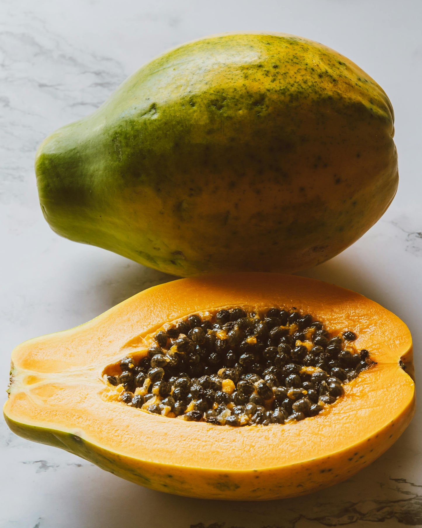 Example of fruit from Amber Lady Papaya plant, for sale in a New Zealand Tropical fruit Nursery.  